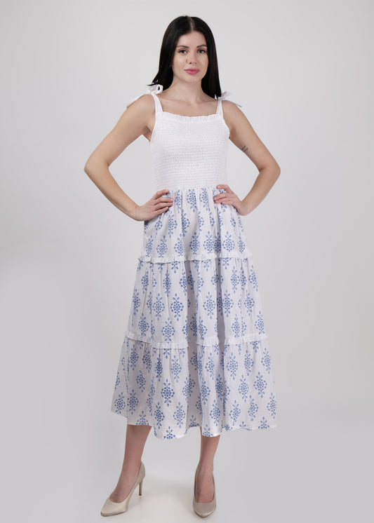 Dress with smocked bodice and all over embroidered tiered panels.